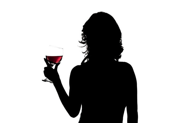 Silhouette, woman holding wine glass