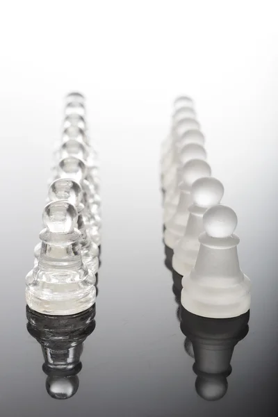 Transparent glass chess pieces — Stock Photo, Image