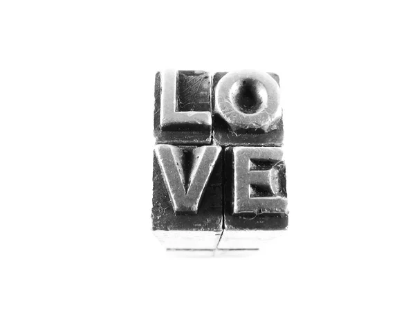 Love sign, antique metal letter type isolated — Stock Photo, Image