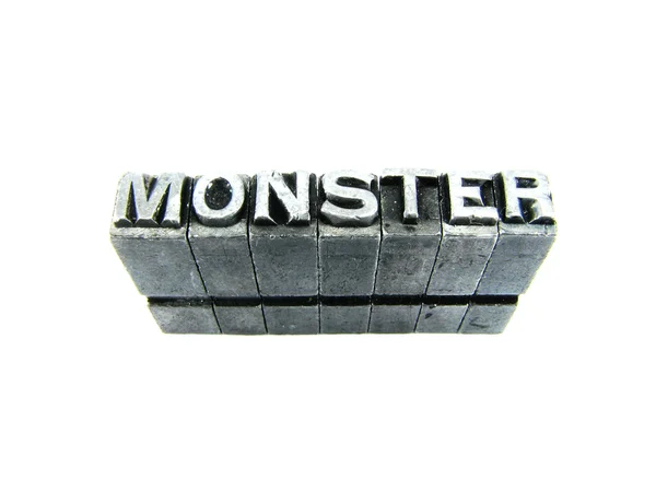 Znak potwora, zabytkowe metalowe typu list na białym tle — Zdjęcie stockowe
