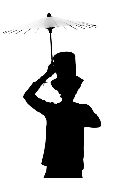 Silhouette di un uomo con un cappello con un ombrello . — Foto Stock