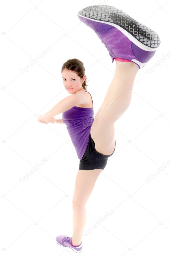 Energetic girl doing kick, logos and trademarks REMOVED