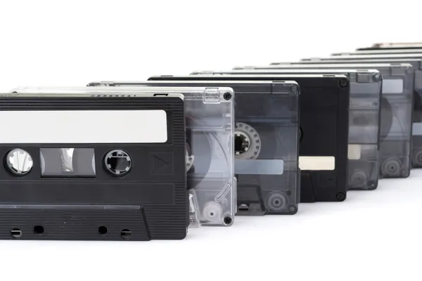 Row of audio tapes isolated on white background — Stock Photo, Image