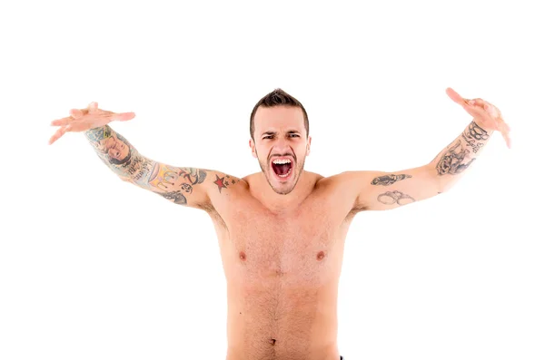 Strong man shouting and roaring with tattoos Stock Picture