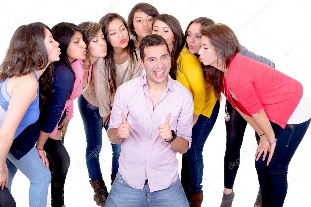 Eight young women kissing handsome man