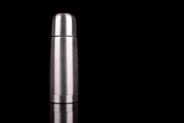 Metal thermos on black background — Stock Photo, Image