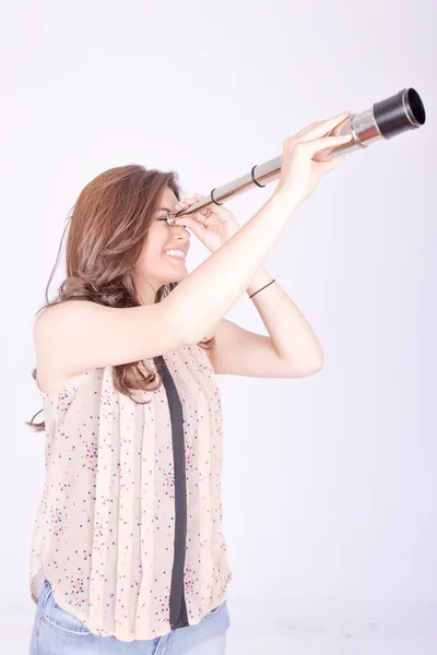 Young woman using telescope — Stock Photo, Image