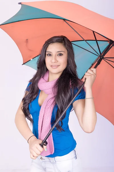 Beautiful young girl with umbrella, studio shot — Stock Photo, Image