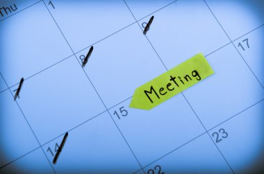 Setting a meeting date on calendar clipart