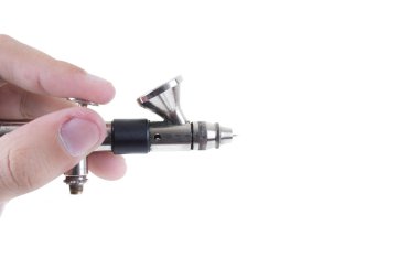 beyaz zemin üzerinde el izole airbrush