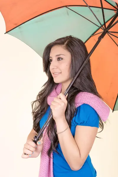 Beautiful young girl with umbrella, studio shot — Stock Photo, Image