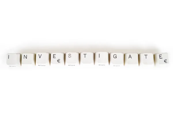 Investigate word written with computer buttons — Stock Photo, Image