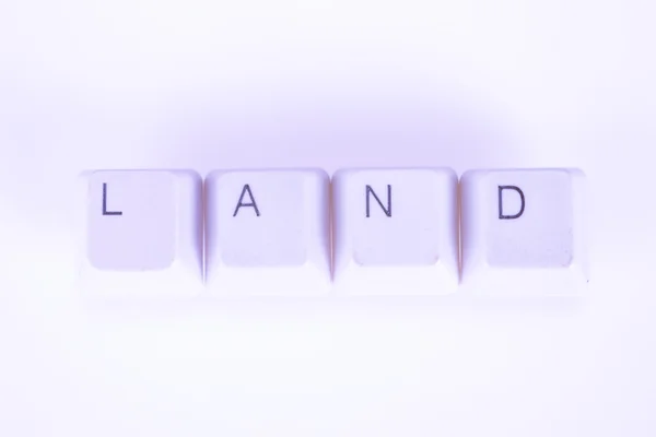 Land Wort mit Computer-Tasten geschrieben — Stockfoto