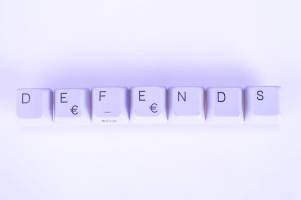 Defends word written with computer buttons — Stock Photo, Image