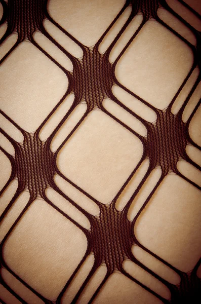 Close up of Caucasian woman in pattern stockings — Stock Photo, Image