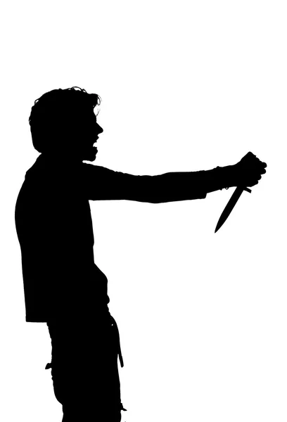 Silhouette of a man attempting suicide knife — Stock Photo, Image