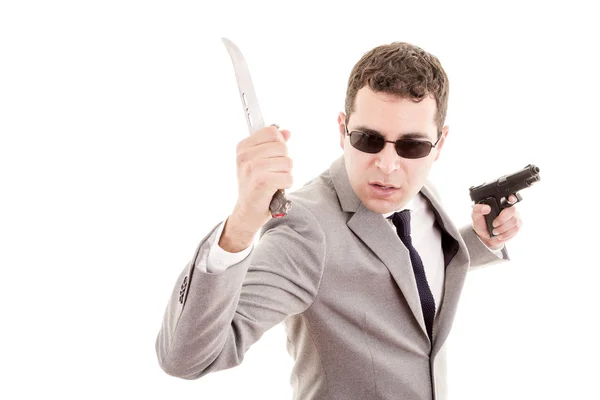 Man in suit with knive and gun — Stock Photo, Image