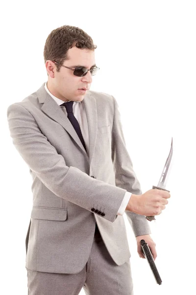 Man in suit with knive and gun — Stock Photo, Image