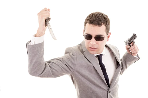 Man in suit with knive and gun — Stock Photo, Image