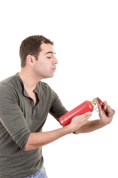 Homem segurando um extintor, isolado em branco — Fotografia de Stock