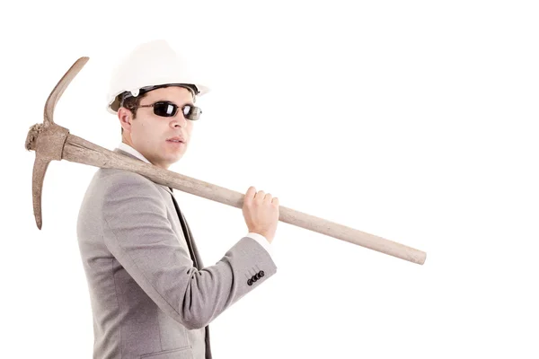 Man in suit displaying pick-axe — Stock Photo, Image