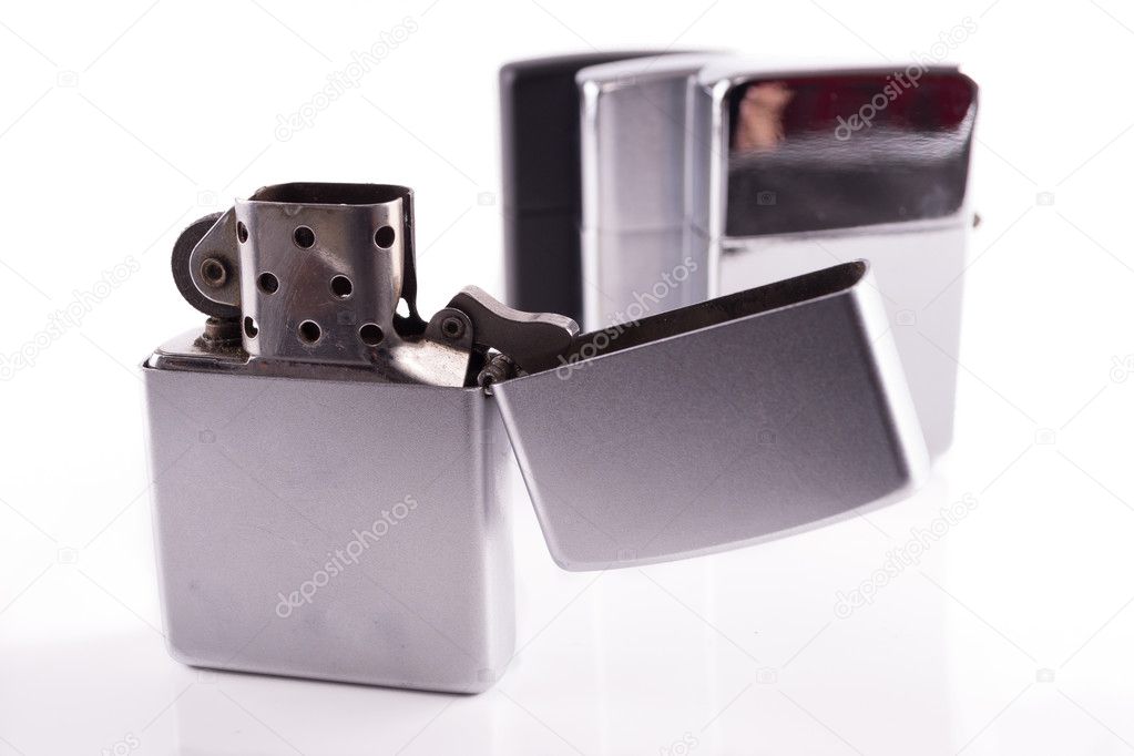 Silver metal zippo lighters on white