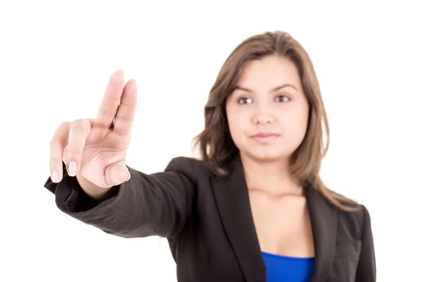 Pretty woman pointing at something in the air — Stock Photo, Image