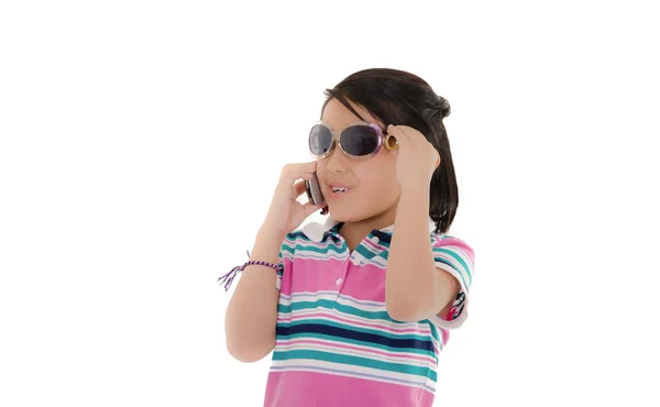 Cute smiling little hispanic girl in sunglasses over white — Stock Photo, Image