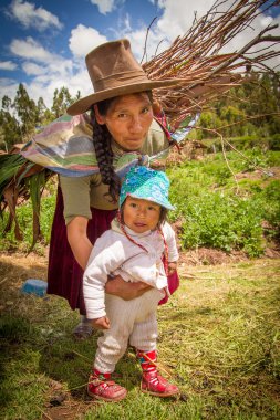 Peruvian Indian Woman in Traditional Dress Weaving