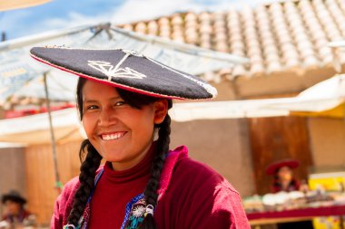 Peruvian Indian Woman in Traditional Dress Weaving