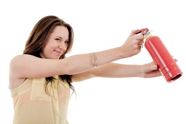 The image of young woman with extinguisher on white — Stock Photo, Image