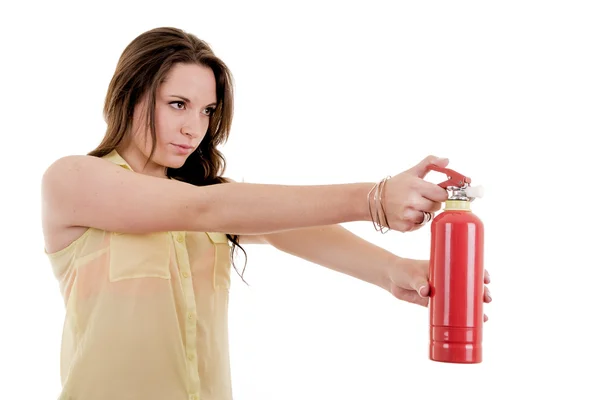 The image of young woman with extinguisher on white — Stock Photo, Image