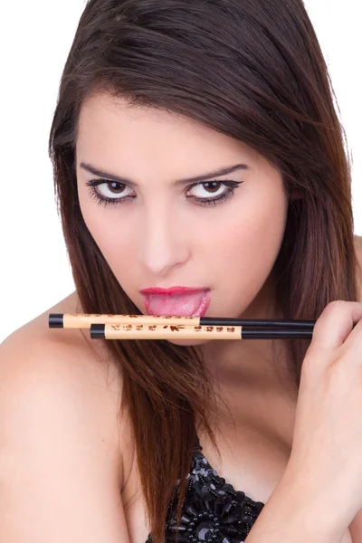 Attractive woman holding chopsticks — Stock Photo, Image