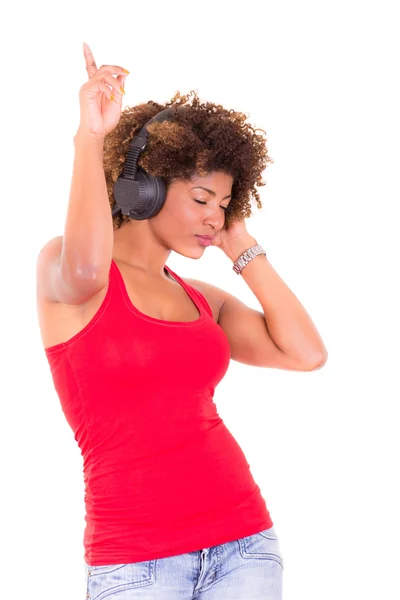 Beautiful African American woman listening to music — Stock Photo, Image