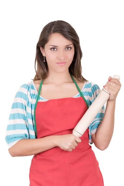 Volledig geïsoleerde studio beeld van een jonge huisvrouw in de keuken — Stockfoto