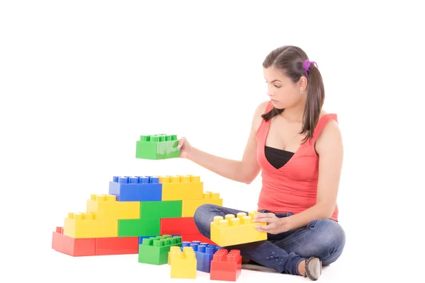 Woman playing with blocks — Stock Photo, Image