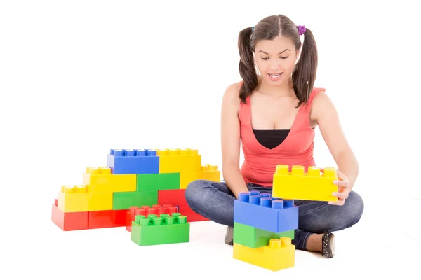 Woman playing with blocks — Stock Photo, Image