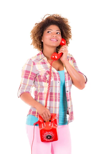 Portrait of a pretty black young woman talking on phone — Stock Photo, Image