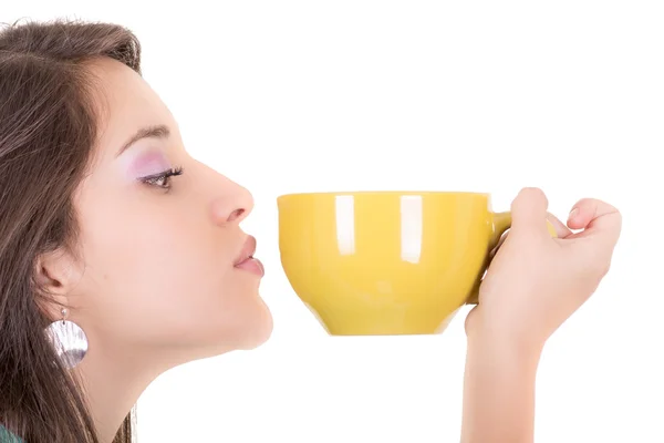 Closeup of yellow cup and a woman face — Stock Photo, Image