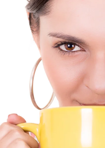 Closeup of yellow cup and a woman face — Stock Photo, Image