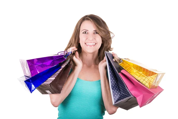 Szczęśliwy hiszpanin kobiece shopper gospodarstwa torby na zakupy - na białym tle nad białym — Zdjęcie stockowe