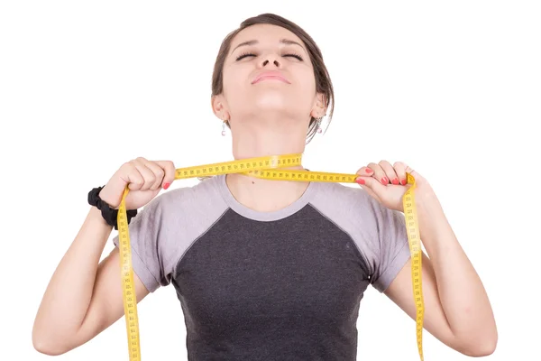 Hmotnost ztráta hispánský žena usmívající se měřicí páska — Stock fotografie