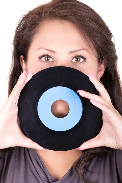 Vacker flicka håller en vinyl - på vit bakgrund — Stockfoto