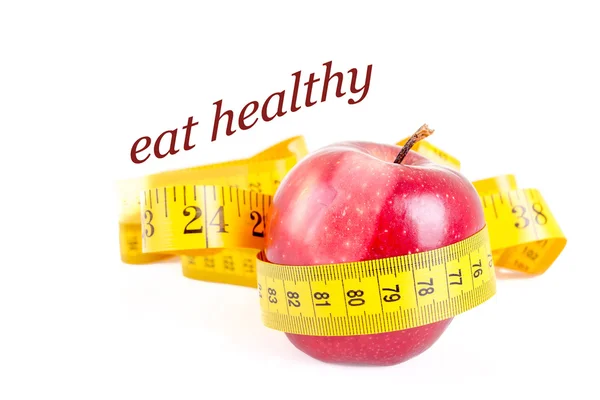 Dieting concept apple with measuring tape — Stock Photo, Image