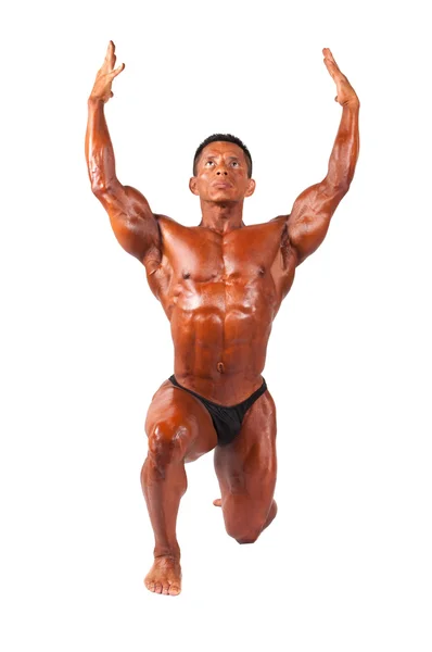 Bodybuilder posing on a white background — Stock Photo, Image