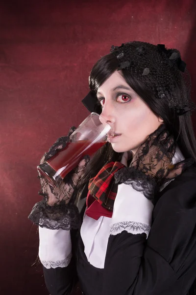 Portrait of a woman in retro costume, with wine — Stock Photo, Image