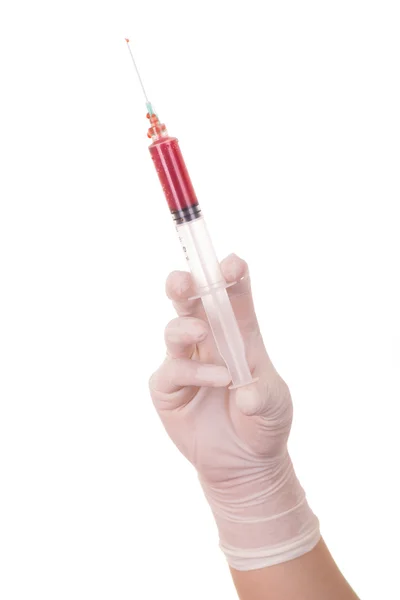 Hand in glove with syringe on white — Stock Photo, Image
