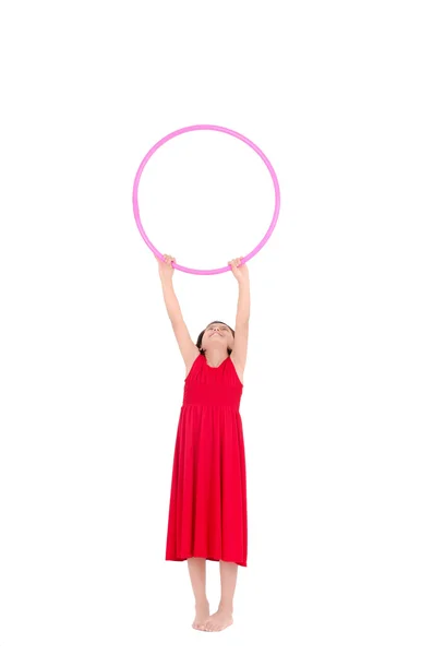 Young girl playing with hula hoop isolated over white background — Stock Photo, Image