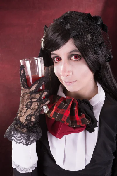 Portrait of a woman in retro costume, with wine — Stock Photo, Image