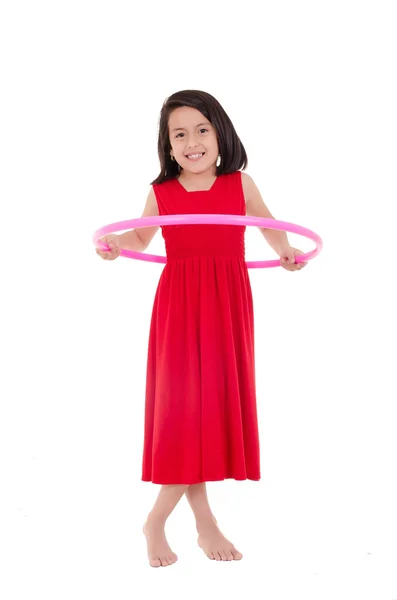 Young girl playing with hula hoop isolated over white background — Stock Photo, Image